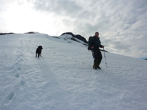 Man and dog running down the east ridge