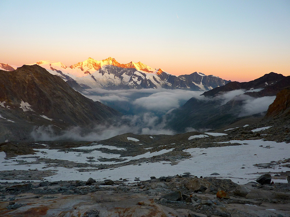 First rays of light hit the peaks in the Mischabel range just before we reach the snow field. Allalinhorn on the very left of the picture