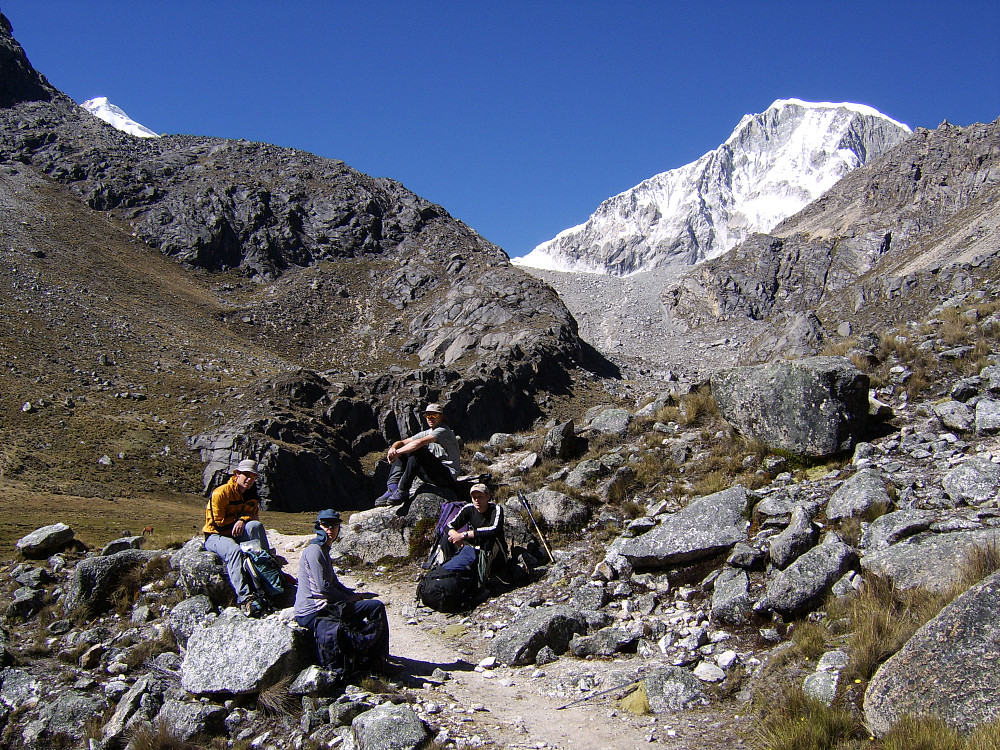 On the walk up to Laguna Ishinca from base camp|center
[[image:hmsv1_peru_july_2005835.jpg|Ranrapalca|center
[[image:hmsv1_peru_july_2005837.jpg|View towards Urus from Laguna Ishinca|center
[[image:hmsv1_peru_july_2005838.jpg|Beneath Ishinca|center

The trail was well-sign-posted, and we took a decent break after about only 40 minutes of walking. After that we walked up to the next “rest” stop at a flat, sandy spot where a number of paths appeared to merge at that junction. We weren’t far from the lake now – about 100-150m in height, and eventually reached the lake after more ascent over the dry, stony path at about 11am. Here we got excellent views of Ishinca and the comparative beast-of-a-mountain next to it, Ranrapalca. It was also an ideal place to have a much-deserved snack break and sit around lazily in the sunshine for another good 40 minutes. Dinner was the usual course of soup followed by some sort of meat casserole and rice. Bedtime at 8pm.
    
[[image:hmsv1_laguna-ishinca.jpg|Panorama from Laguna Ishinca