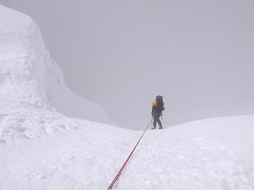 Descending into thick fog from the col near high camp