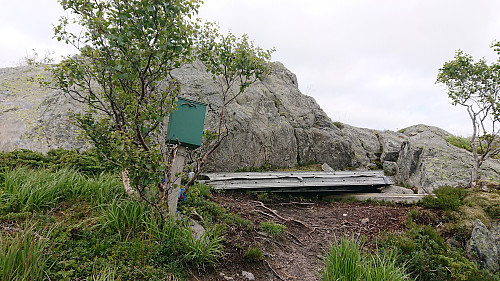 The visitor register below the summit