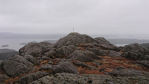 Looking back at the summit of Utslettefjellet from the trig marker