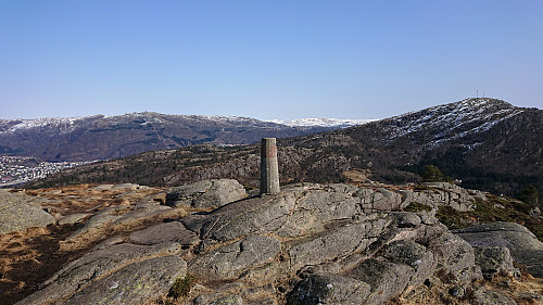 The trig marker at Olsokfjellet with Ulriken to the left and Løvstakken to the right